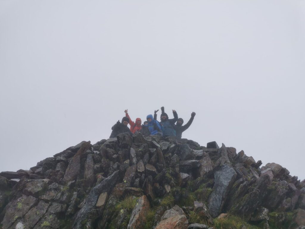 Image of climbers reaching the top of Snowdon